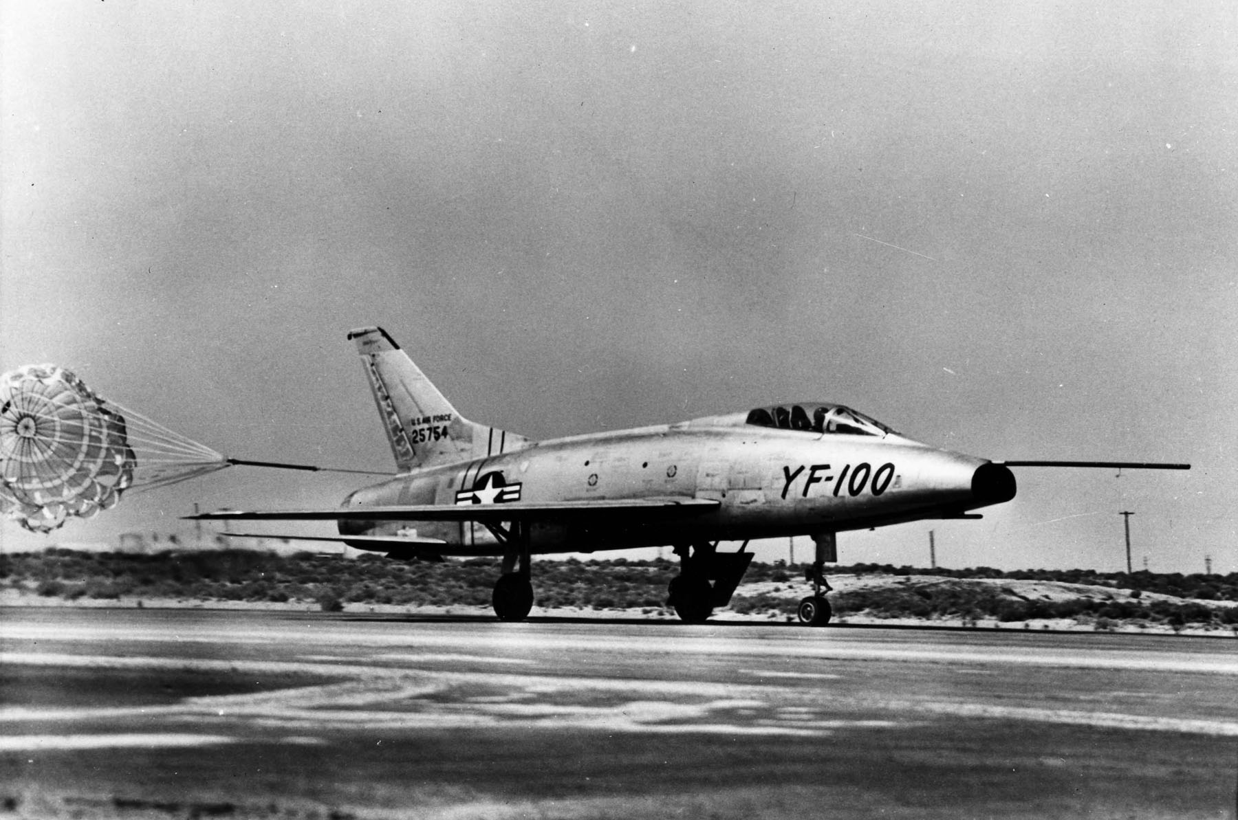 North American Aviation pre-production prototype YF-100A Super Sabre 52-5754 with drag chute deployed on landing at Edwards Air Force Base, California. (U.S. Air Force)