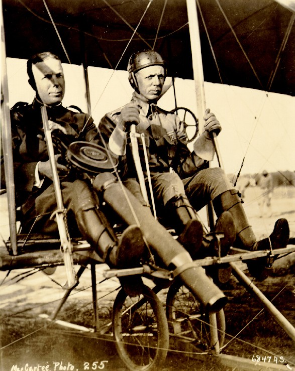  Captain Charles deForest Chandler mans a prototype Lewis machine gun with Lieutenant Roy C. Kirtland at the controls of a Wright Model B, at College Park, MD. (U.S. Air Force)