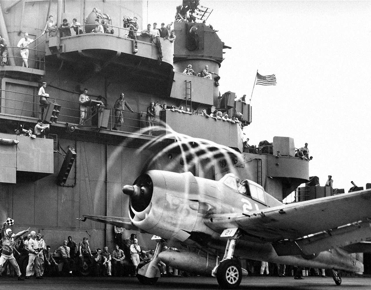 High humidity creates visible propeller tip vortices as this Grumman F6F Hellcat prepares to takeoff from an Essex-class aircraft carrier. (U.S. Navy)