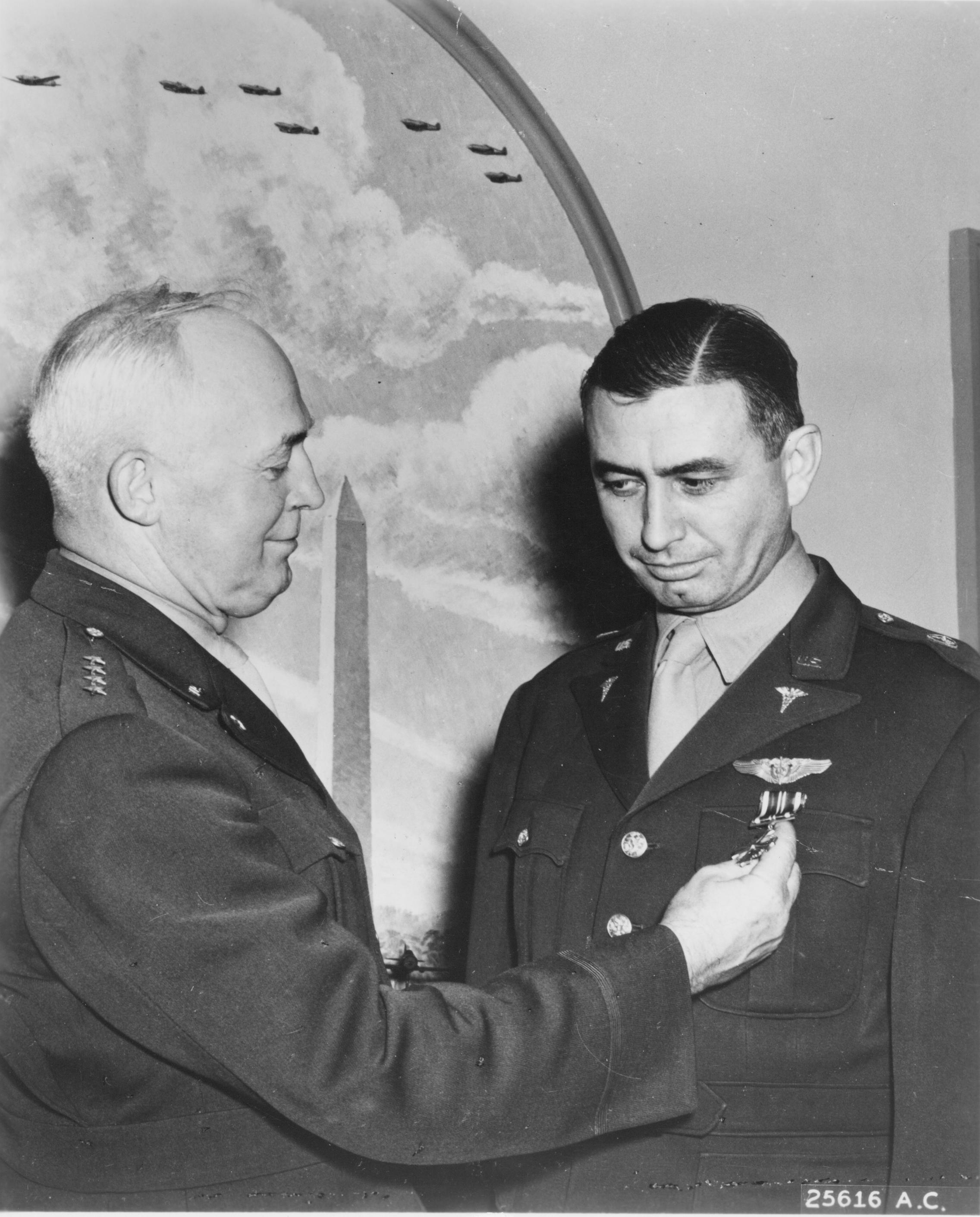 Lieutenant Colonel William.R. Lovelace II, M.D., U.S. Army Medical Corps, receives the Distinguished Flying Cross from General Henry H. Arnold, Commanding General, U.S. Army Air Forces. (U.S. Air Force)