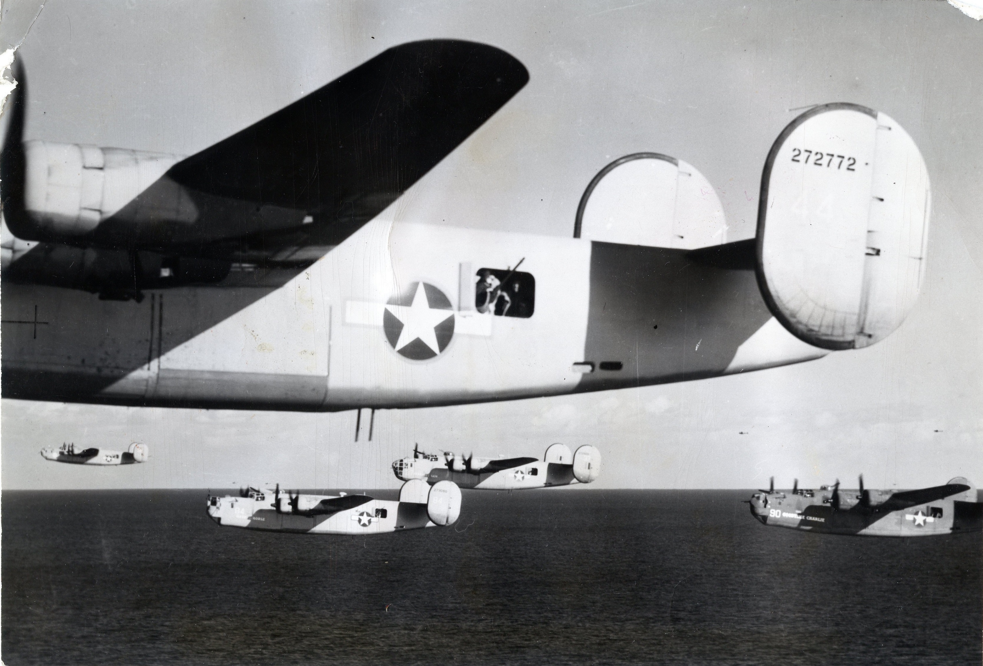Consolidated B-24D-155-CO Liberator 42-72772 and flight cross the Mediterranean Sea at very low level, 1 August 1943. (U.S. Air Force) 