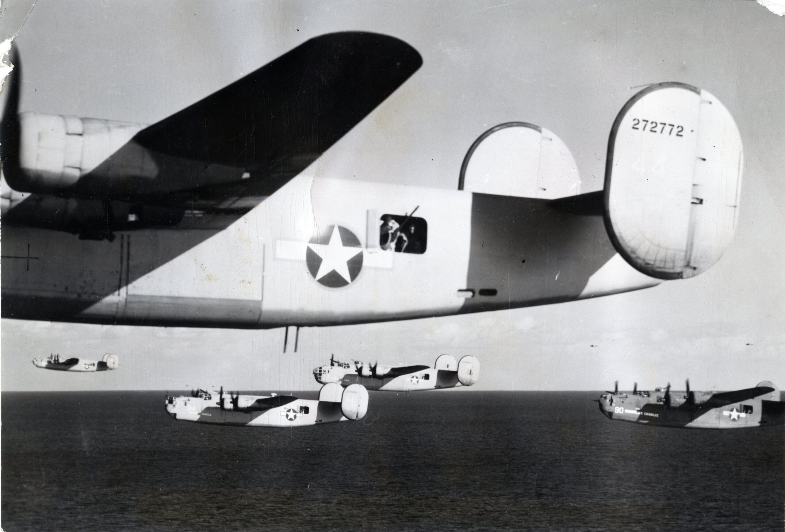 Consolidated B-24D-155-CO Liberator 42-72772 and flight cross the Mediterranean Sea at very low level, 1 August 1943. (U.S. Air Force) 