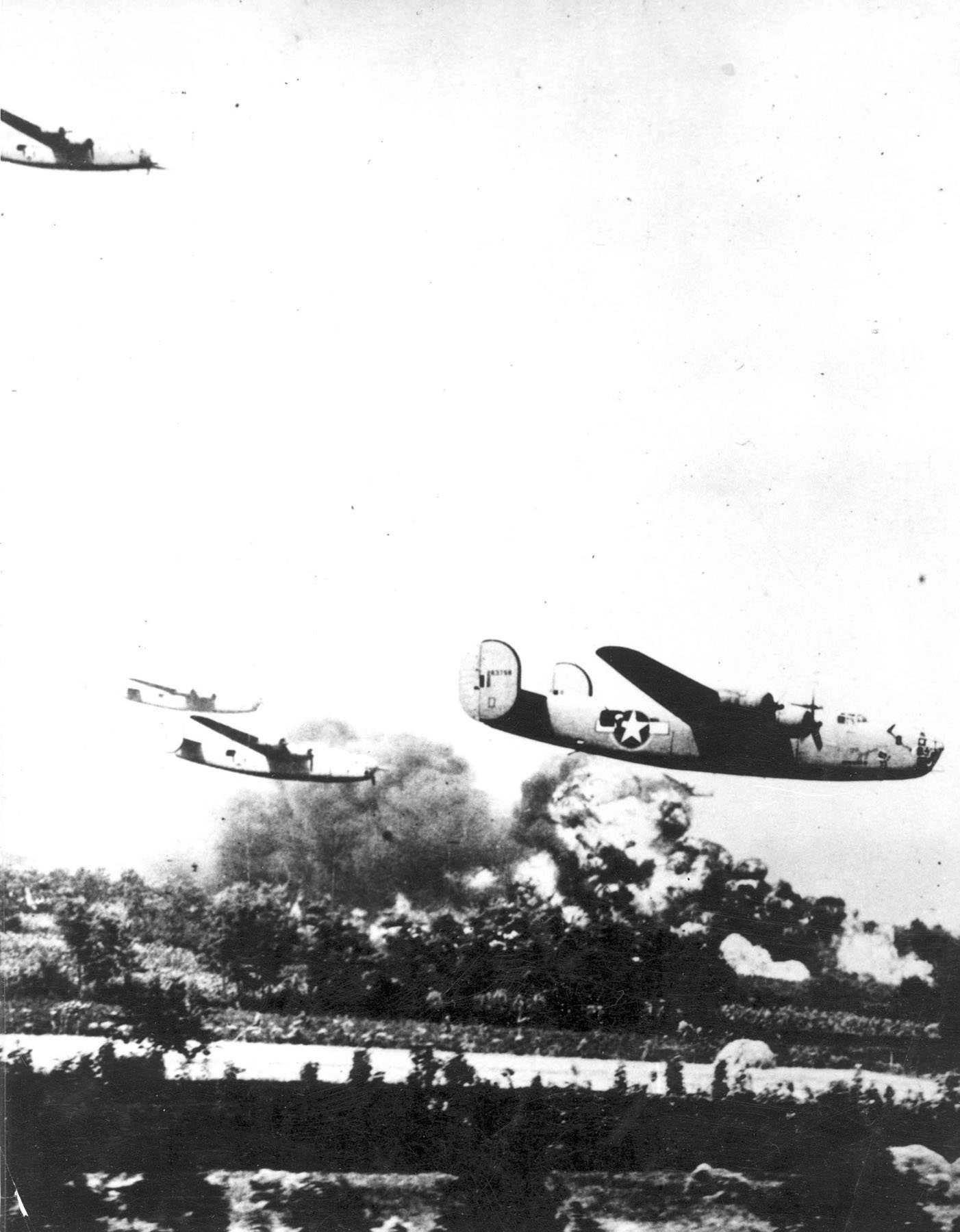 Consolidated B-24D Liberator very long range heavy bombers attack the oil refineries at Ploesti, Romania, 1 August 1943. (U.S. Air Force)