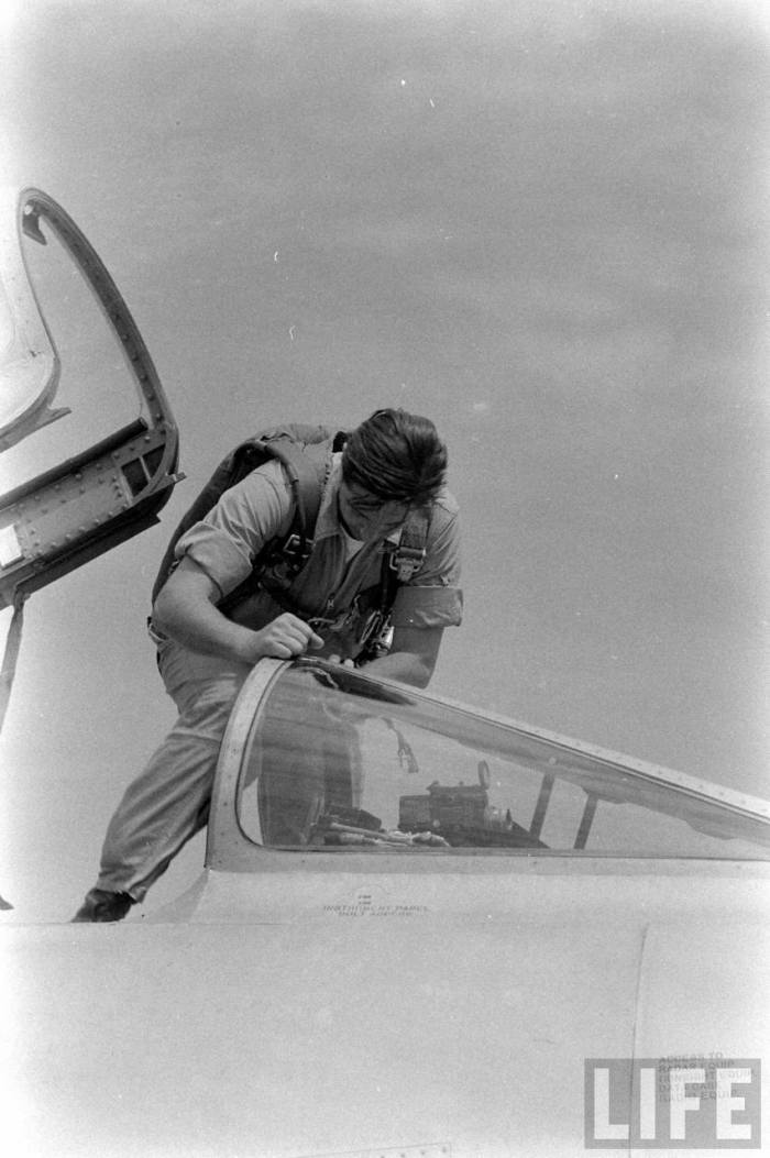 Scott Crossfield climbs into the cockpit of a North American Aviation F-100A-5-NA Super Sabre. (LIFE Magazine via Jet Pilot Overseas)