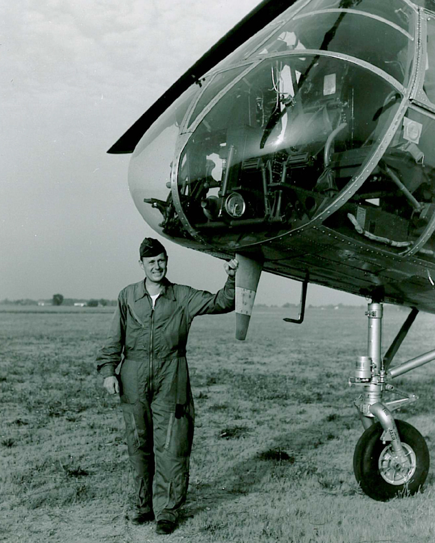 Captain Russell M. Dobyns, United States Air Force, with his YH-21 Workhorse. (FAI)