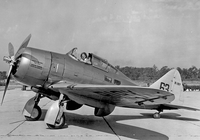 Jackie Cochran in the cockpit of the Seversky SEV-2S Executive, NR18Y. Note the passenger windows below and behind the cockpit. (San Diego Air and Space Museum Archives)