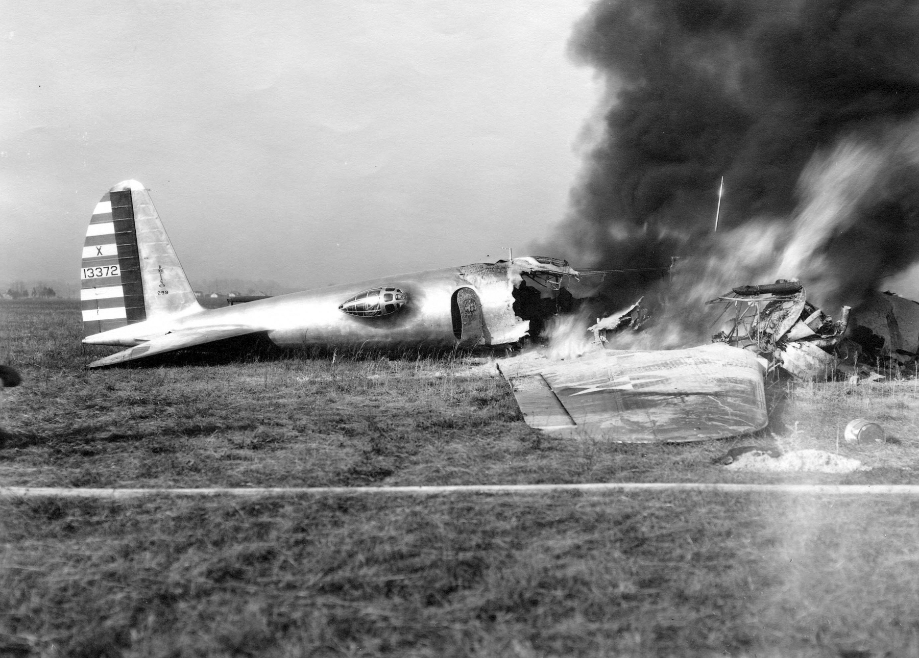 The wreck of the Boeing Model 299, NX13372, burns after the fatal crash at Wright Field, 30 October 1935. (U.S. Air Force)