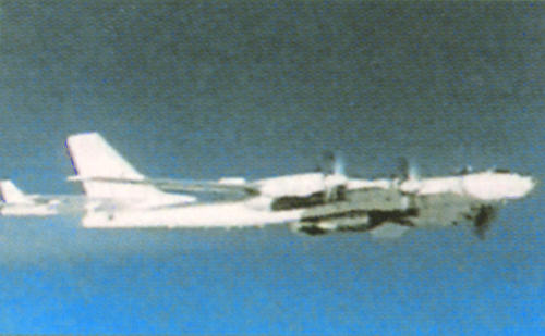 Major Durnovtsev's Tupolev Tu-95N Bear A, carrying the RDS-220 bomb to the target. A Tu-16 instrumentation aircraft is just behind, on the bomber's left quarter. 