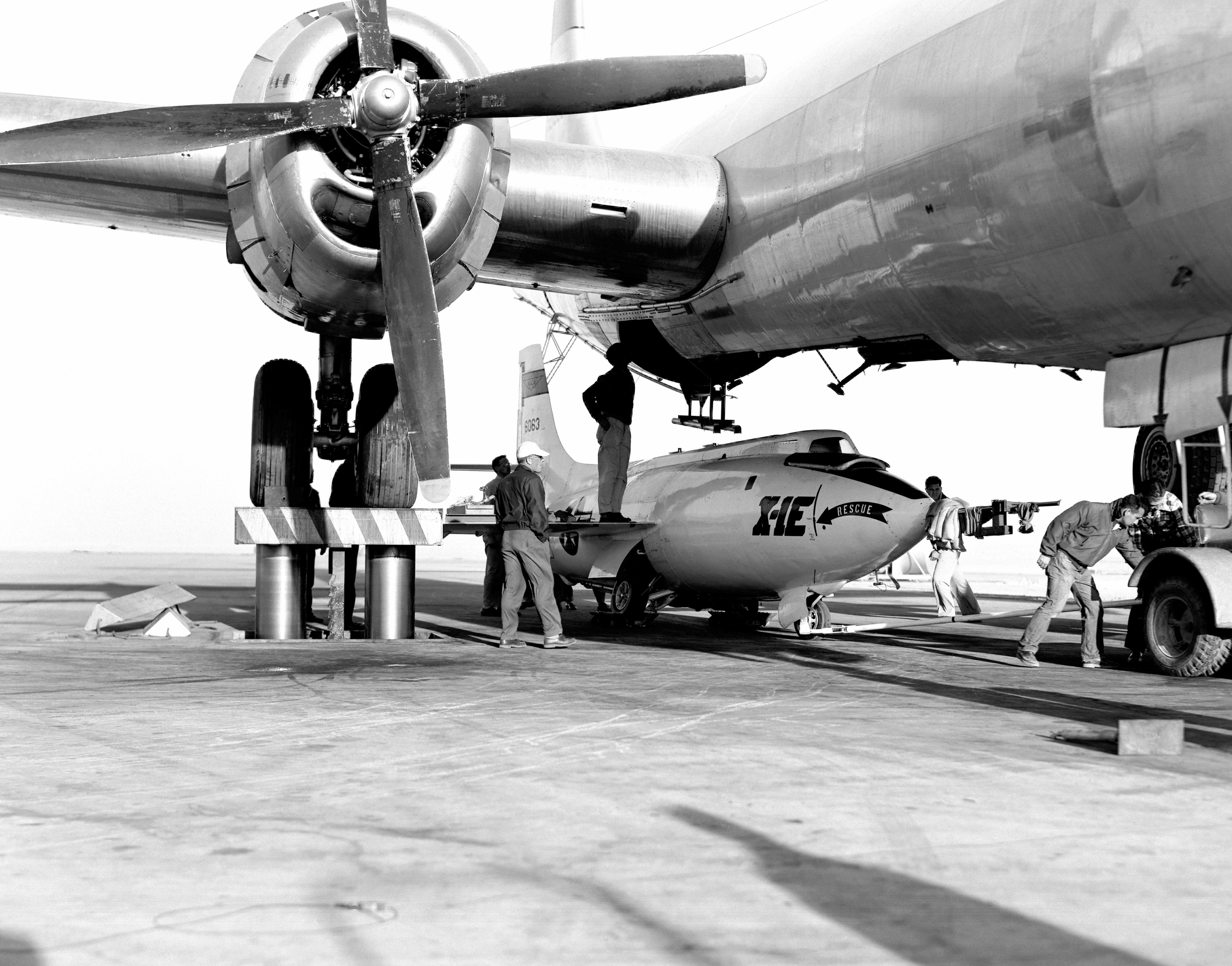 The Bell X-1E rocketplane being loaded into a Boeing B-29 Superfortress mothership for another test flight. (NASA)