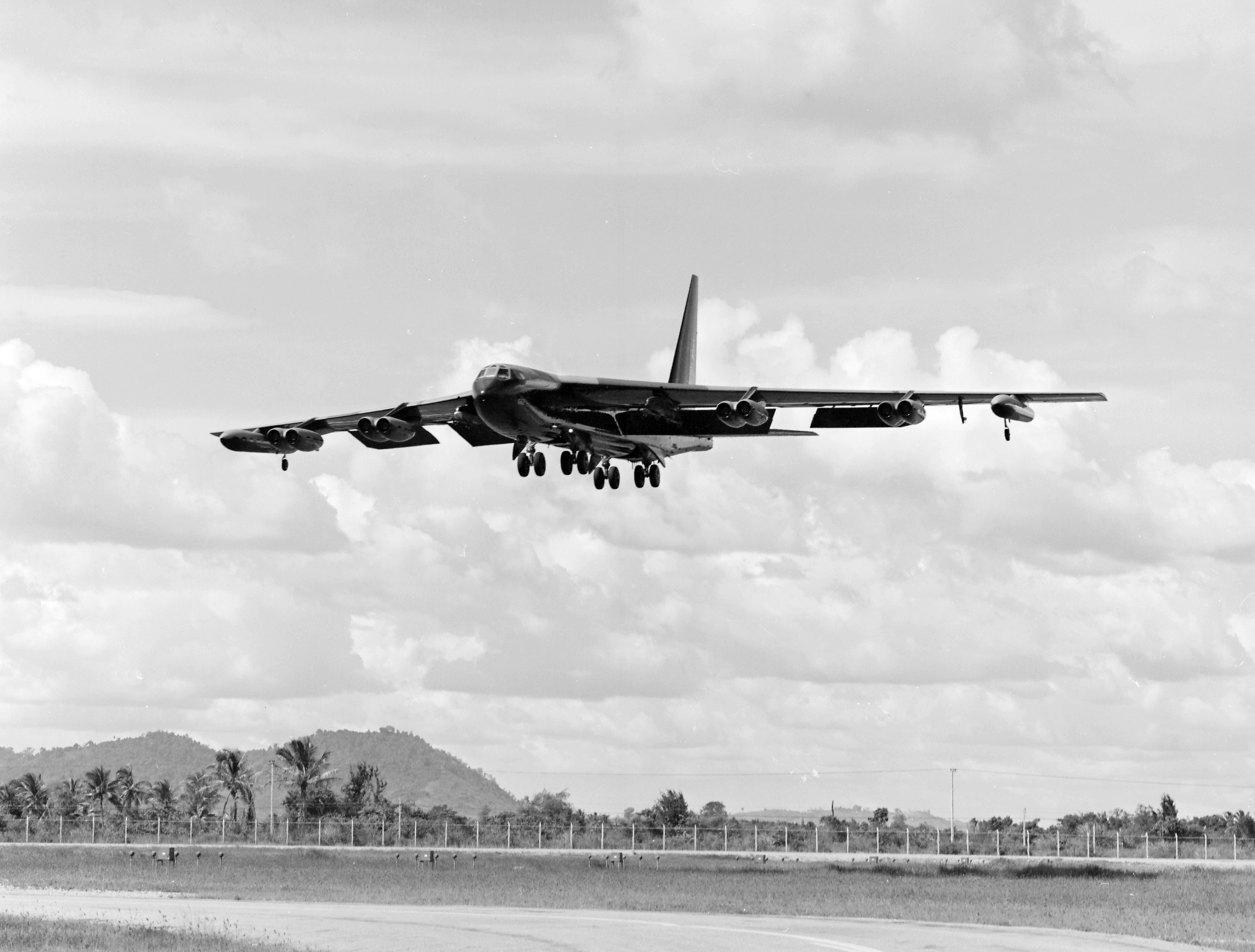 Boeing B-52D-30-BW Stratofortress 55-662 crosses the perimeter fence on approach to U-Tapao Airfield, Thailand. OLIVE 2 did not return from its final mission. (U.S. Air Force)