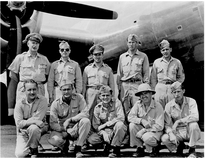 Colonel Clarence S. Irvine (standing, left) with the crew of Pacusan Dreamboat: W.J.Benett, G.F.Broughton, Dock West, W.S. O'Hara, F.S. O'Leary, K.L. Royer, F.J.Shannon, J.A. Shinnault, G.R. Stanley. (FAI)