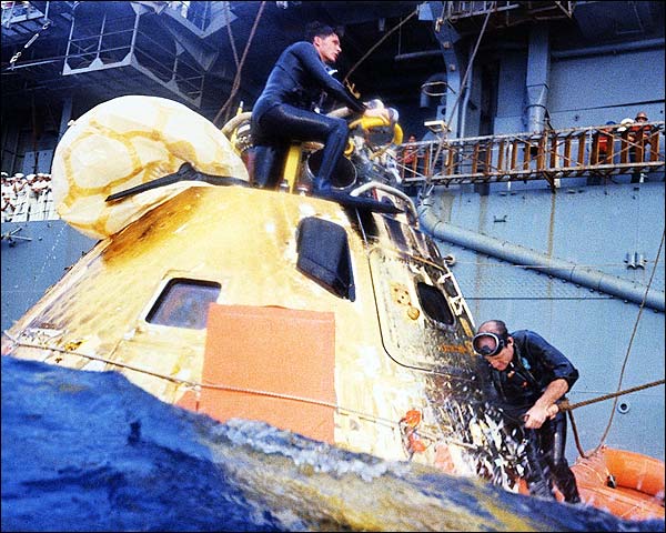 U.S. Navy swimmers prepare the Apollo 8 command capsule to be hoisted aboard USS Yorktown (CVS-10) in the Pacific Ocean, 27 December 1968. (U.S. Navy)