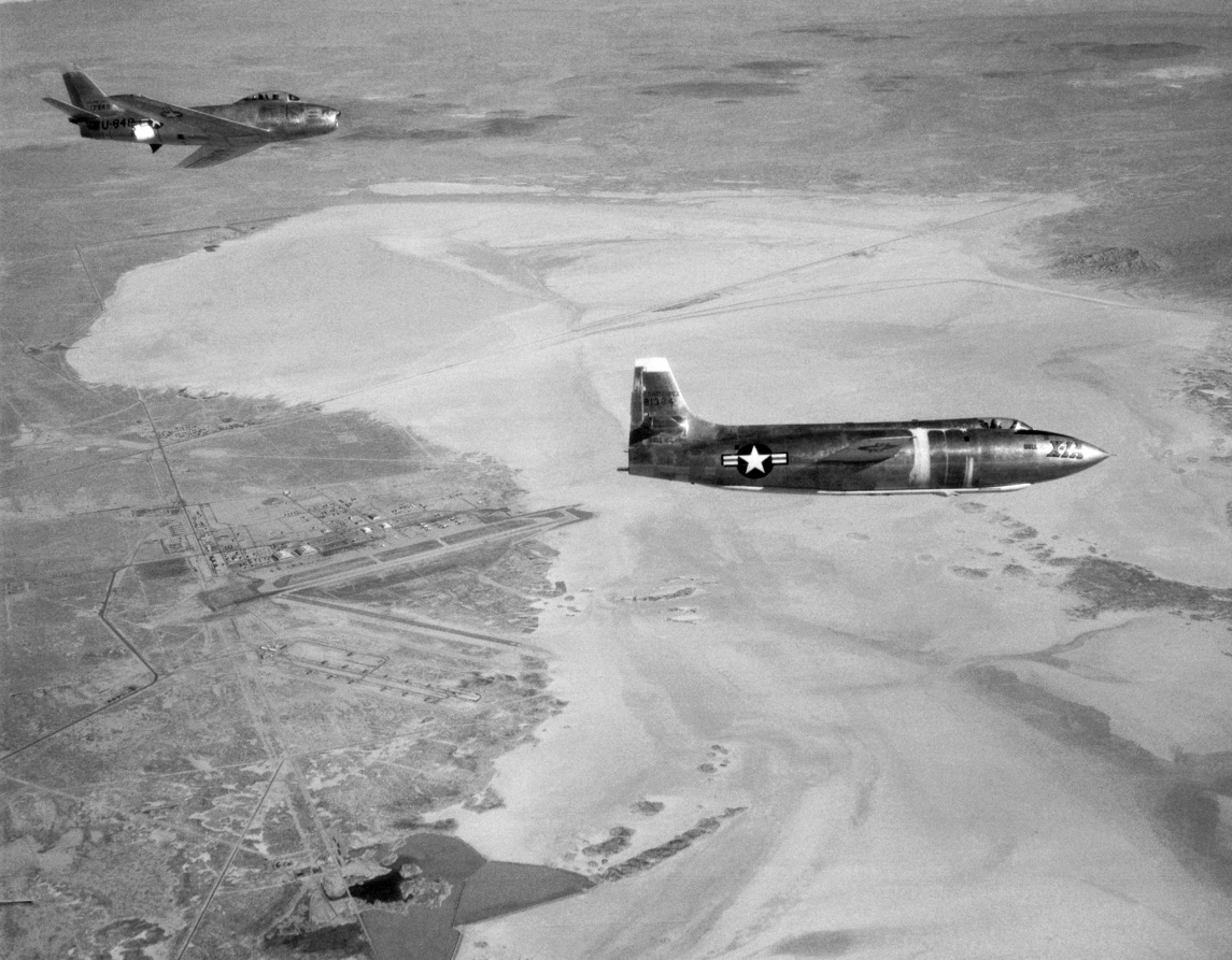 A North American F-86E-10-NA Sabre chase plane, 51-2848, follows the Bell X-1A as it glides toward Rogers Dry Lake. (NASA)