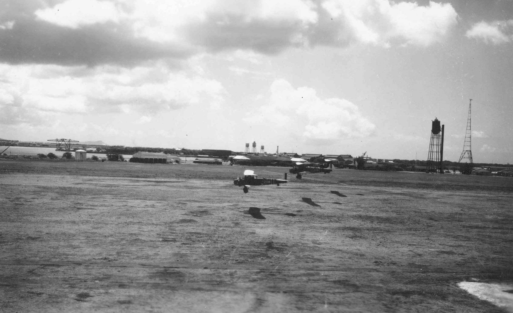 A flight of three Keystone B-3A bombers of the 23d Bombardment Squadron take off at Luke Field, Territory of Hawaii. Diamond Head is visible in the background. (U.S. Air Force)