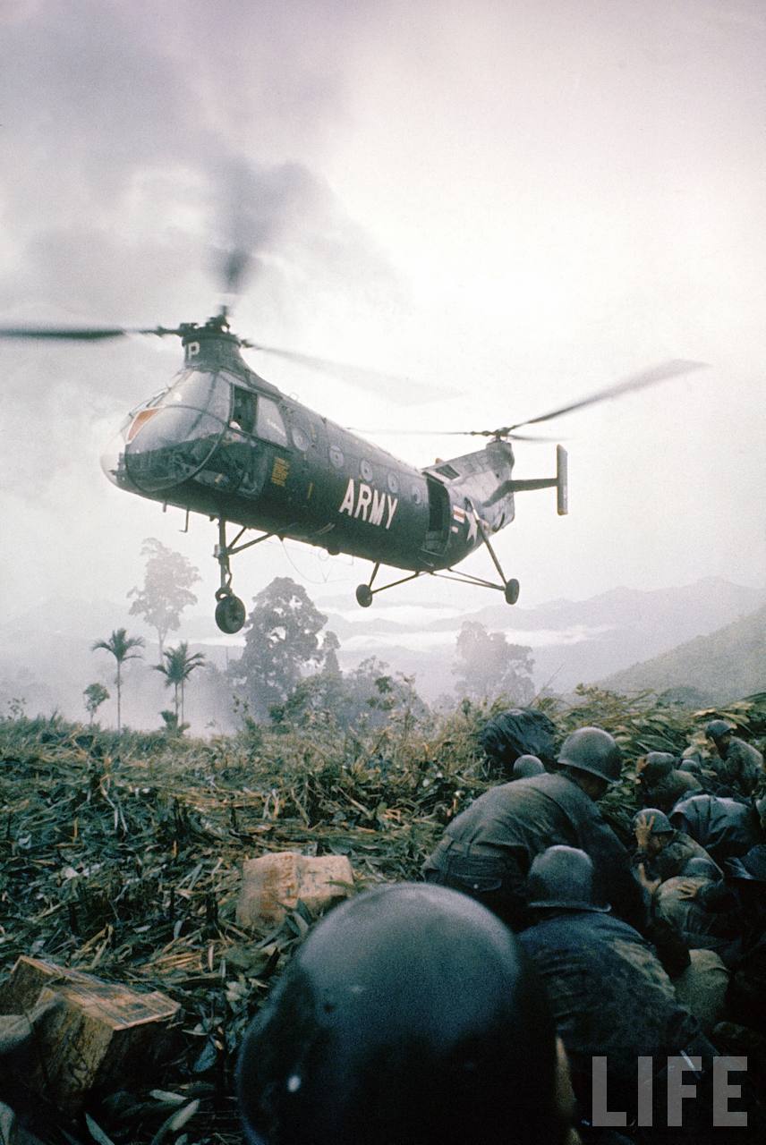 ARVN troops wait while a U.S. Army CH-21C Shawnee lands. (LIFE Magazine)