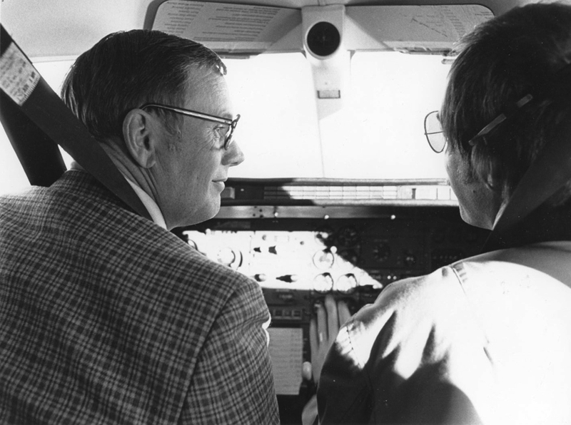 Professor Neil Armstrong and co-pilot Peter Reynolds in the cockpit of the record-setting Learjet 28, March 1979.