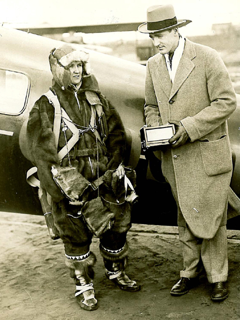 Ruth Nichols with man holding barograph after setting FAI World Altitude Record. (FAI)