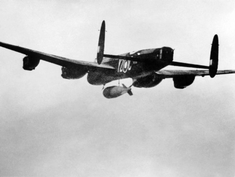 Pilot Officer P. Martin's Avro Lancaster B Mk.I Special, PB996, YZ-C, releases the 22,000-pound Grand Slam earth-penetrating bomb over teh railway viaduct at Arnsberg, Germany, 19 March 1945. (Imperial War Museum)