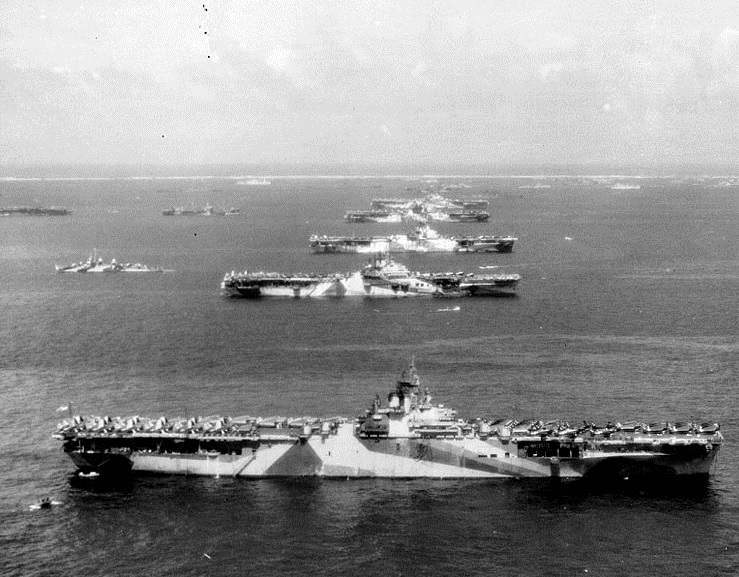 "Murderers' Row" Third Fleet aircraft carriers at anchor in Ulithi Atoll, 8 December 1944, during a break from operations in the Philippines area. The carriers are (from front to back): USS Wasp (CV-18), USS Yorktown (CV-10), USS Hornet (CV-12), USS Hancock (CV-19) and USS Ticonderoga (CV-14). Wasp, Yorktown and Ticonderoga are all painted in camouflage Measure 33, Design 10a. Photographed from a USS Ticonderoga plane. Official U.S. Navy Photograph #: 80-G-294131