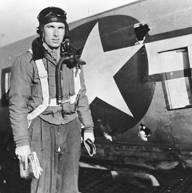 1st Lieutenant Raymond L. Knight with a battle-damaged Republic P-47D Thunderbolt fighter bomber. (U.S. Air Force)