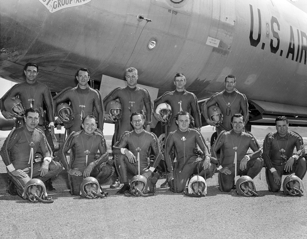 Flight crew of a Convair B-36 Peacemaker, 4925th Test Group (Atomic) during Operation Teapot, 1955. The crewmen are wearing David Clark Co. S-2 capstan-type partial-pressure suits for protection at high altitude. The two white helmets are early K-1 "split shell" 2-piece helmets, while the green helmets are later K-1 1-piece models. (U.S. Air Force via Jet Pilot Overseas)