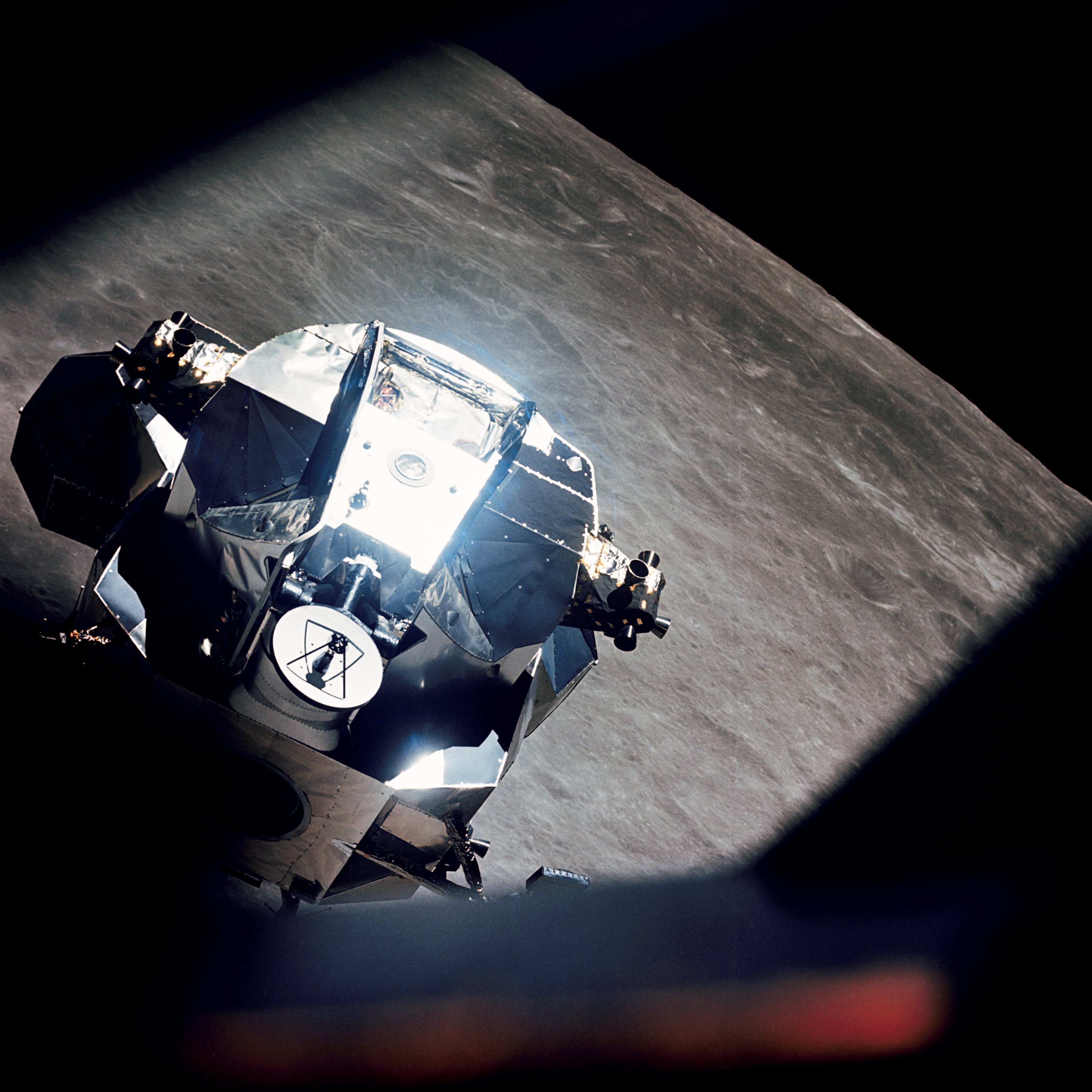 After descending to within 8.2 miles of the Moon's surface, Lunar Module Snoopy rendezvous with Command Module Charlie Brown in Lunar Orbit, 22 May 1969. (NASA)