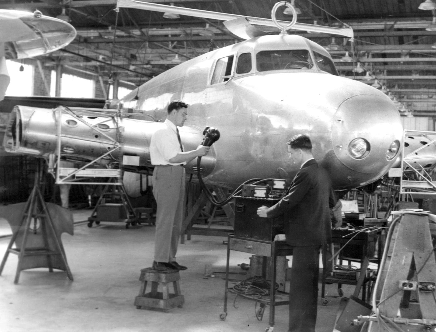 Lockheed engineers use X-ray equipment to scan for hidden damage while the Electra undergoes repairs at Lockheed Aircraft Company, Burbank, California, May 1937.