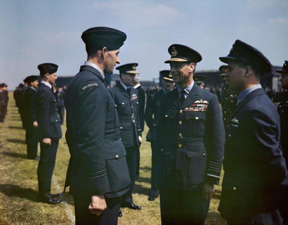 The King has a word with Flight Lieutenant Les Munro from New Zealand. Wing Commander Guy Gibson is on the right and Air Vice Marshal Ralph Cochrane, Commander of No 5 Group is behind Flight Lieutenant Munro and to the right. (Imperial War Museum TR 999)