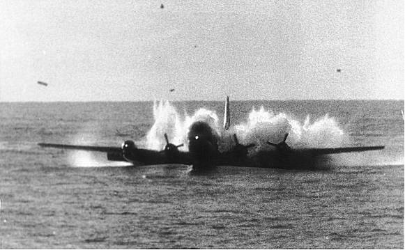 Pan American World Airways Flight 6, a Boeing 377 Stratocruiser, ditches in the North Pacific Ocean near USCGC Pontchartrain (WHEC 70), 6:15 am., 16 October 1956. (U.S. Coast Guard) 