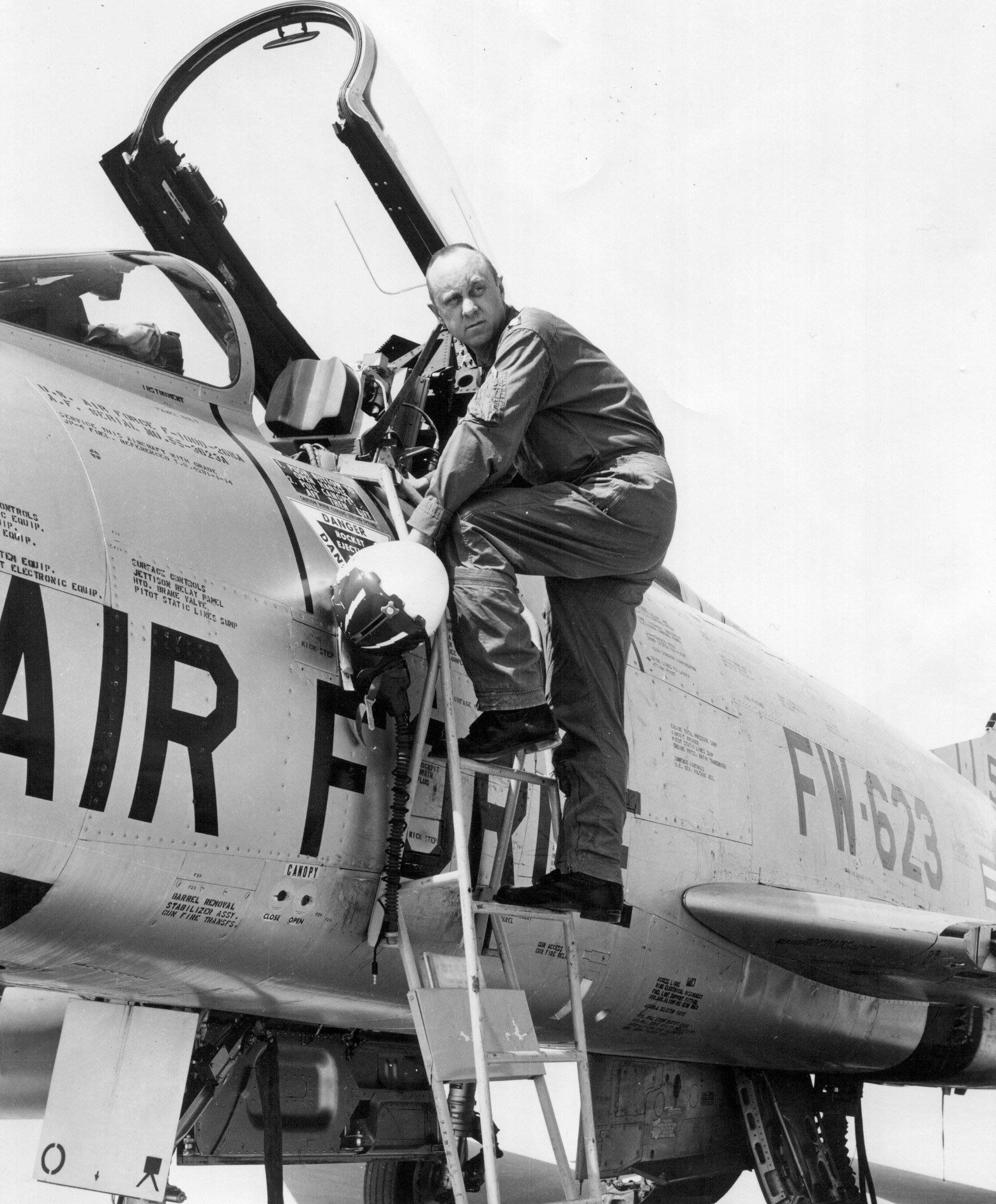 Lieutenant Colonel Harold E. Comstock, U.S. Air Force, 481st Tactical Fighter Squadron, 26th Tactical Fighter Wing, with a North American Aviation F-100D-26-NA Super Sabre, 55-3623, at Cannon Air Force Base, New Mexico, 1964. (Jet Pilot Overseas)