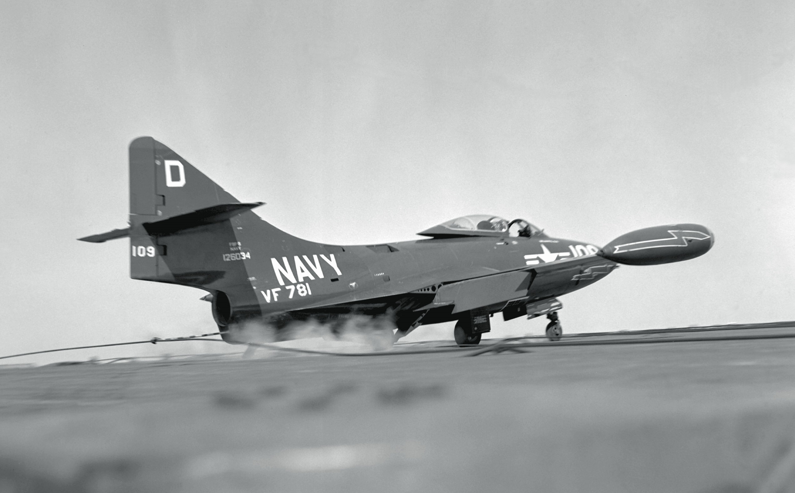 Grumman F9F-5 Panther, Bu. No. 126034, of VF-781, catches an arresting cable when landing aboard USS Oriskany (CVA-34), 1952. (U.S. Navy)