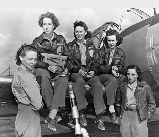 Pilots of the Women's Auxiliary Ferrying Squadron at Long Beach Army Airfield, 1943. Left to right, Barbara Towne, Cornelia Clark Fort, Evelyn Sharp, Barbara Erickson and bernice Batten. The airplane is a Vultee BT-13 Valiant. (Texas Women's University)