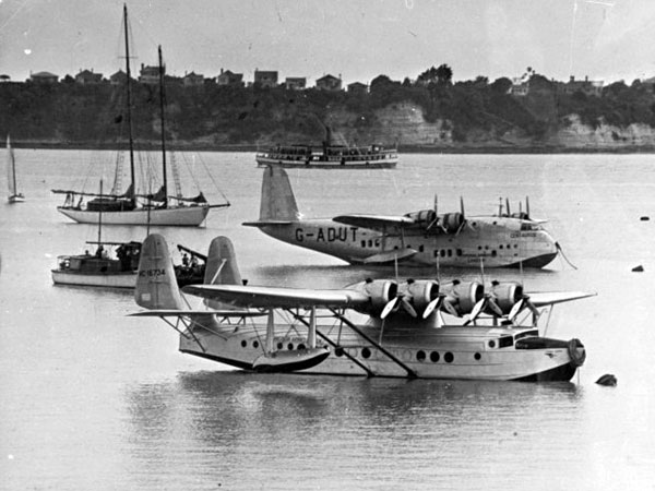 Pan American Airways' Sikorsky S-42B NC16734, Samoan Clipper, moored at mechanic's Bay, Auckland, New Zealand, December 1937. The flying boat in the background is a Short S.23 Empire, G-ADUT, named Centaurus. (Turnbull Library)