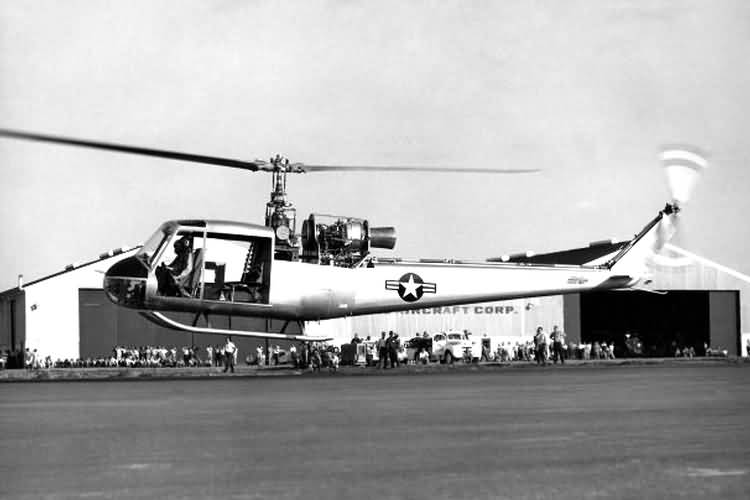 The Bell XH-40 prototype hovering in ground effect at the Bell Aircraft Company plant at Hurst, Texas. The helicopter's cowlings are not installed in this photograph. (U.S. Army)
