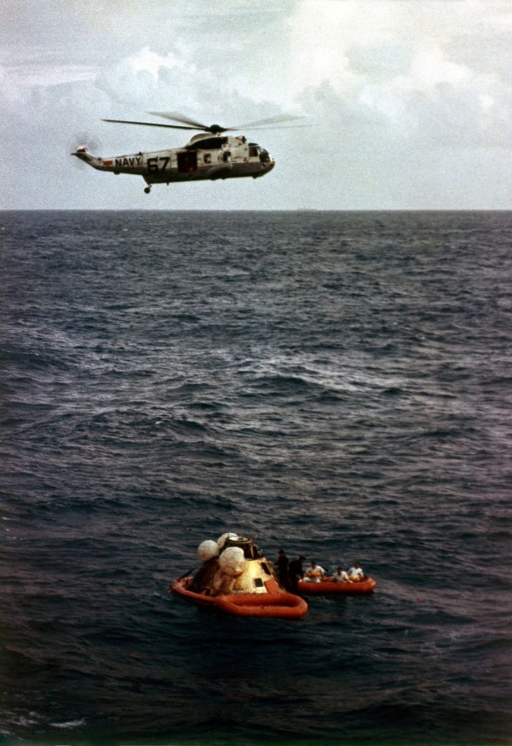 A Sikorsky SH-3D Sea King of HS-4 hovers nearby during recovery operations after Apollo 8 lands in the Pacific Ocean, 27 December 1968. (Otis Imboden/National Geographic)