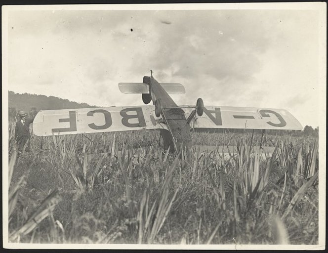 Guy Menzies "Southern Cross Junior," an Avro Avian aircraft, upside down in a swamp at Harihari on the West Coast of New Zealand. Photographed by L A Inkster on the 7th of January 1931.