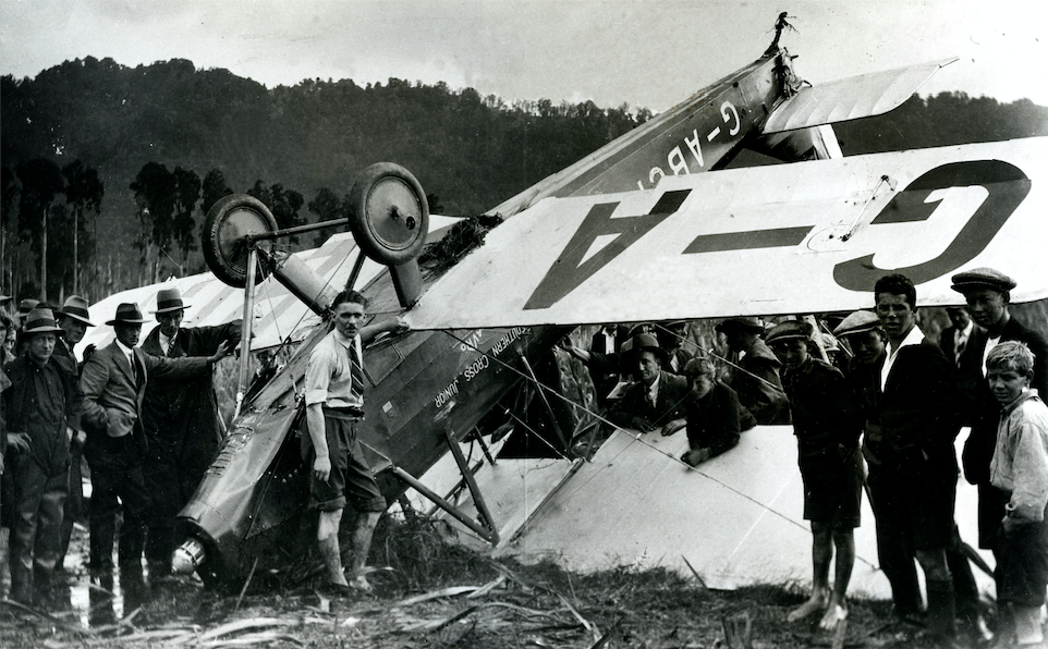 Guy Menzies with his wrecked Avro Avian, G-ABCF, at the La Fontaine Swamp. (Archives New Zealand)