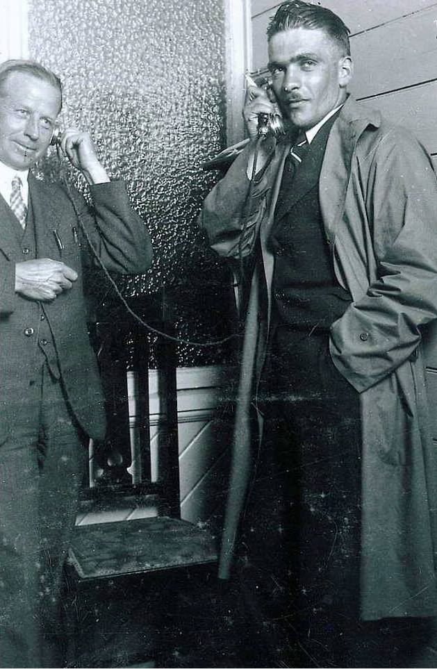 Hokitika postmaster Ralph Cox with pioneer aviator Guy Menzies, notifying Menzies' parents of his arrival in New Zealand. (Photograph from The Auckland Weekly News, 14 January 1931, via West Coast New Zealand History)