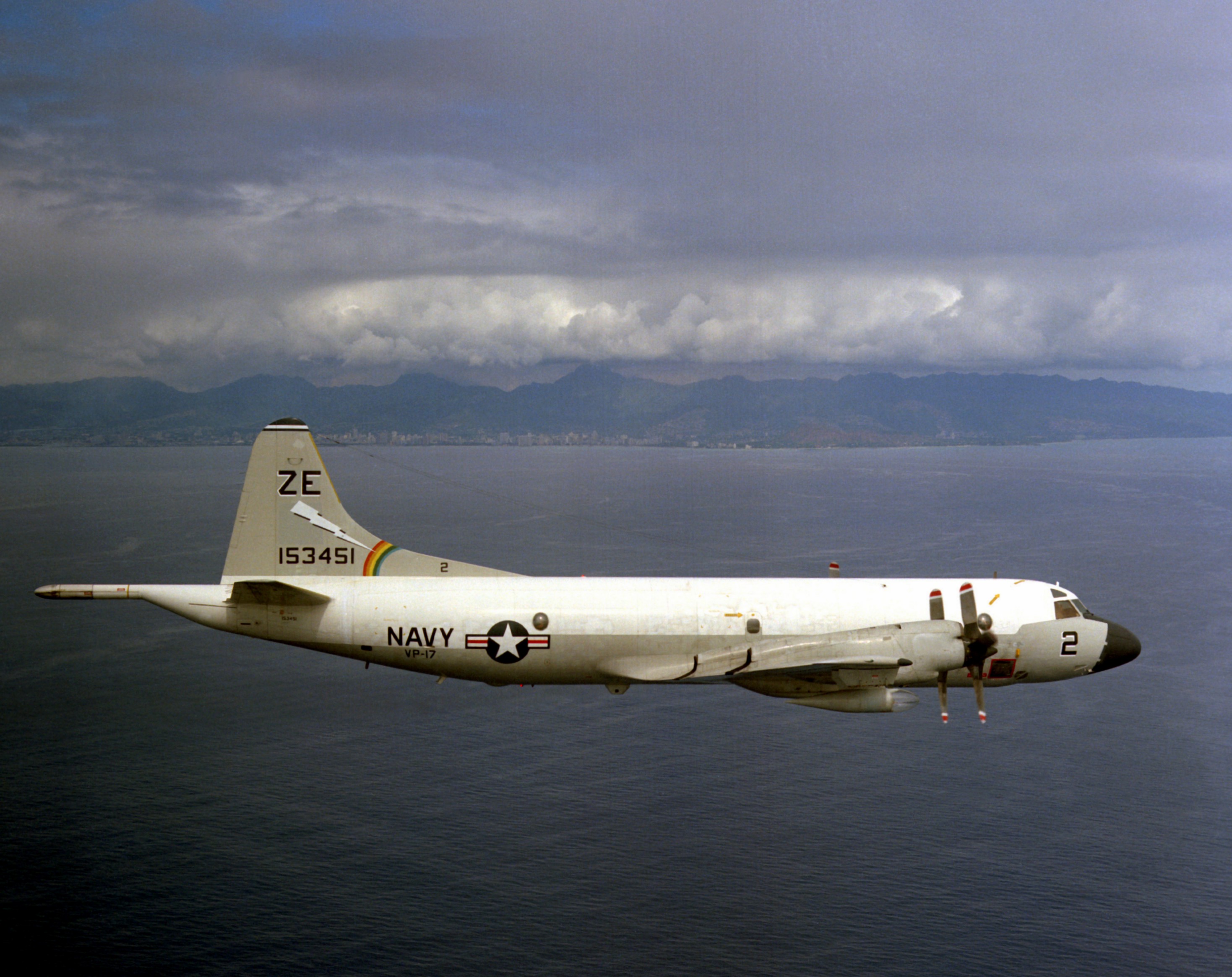 A Lockheed P-3B Orion, Bu. No. 153451, Patrol Squadron 17, off Ohau, 1976. (PH2 (AC) Westhusing, U. S. Navy)
