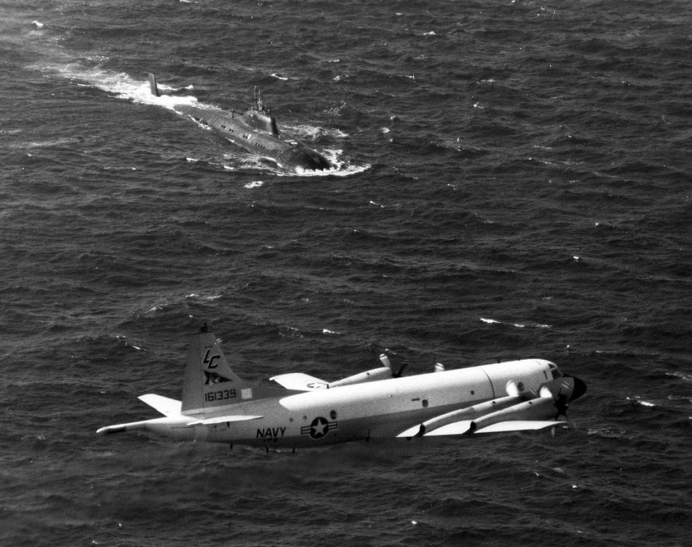 Hunter and prey. A U.S. Navy Lockheed P-3C Orion escorts a nuclear-powered Soviet Victor-III attack submarine. (U.S. Navy)