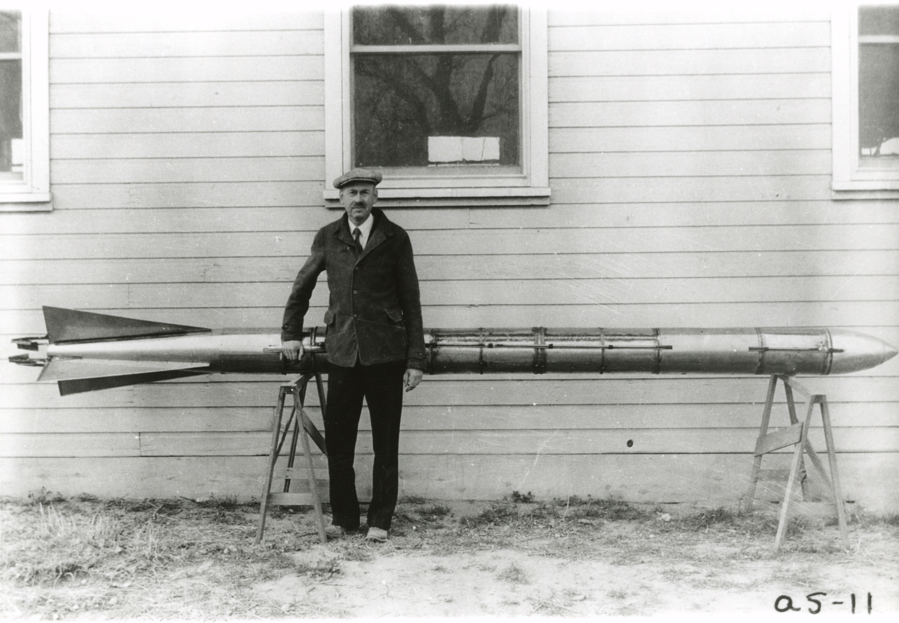 Dr. Robert H. Goddard with one of his liquid-fueled A-series rockets at Roswell, New Mexico, circa 1935. (National Air and Space Museum Archives, Smithsonian Institution, Image Number 84-8949)