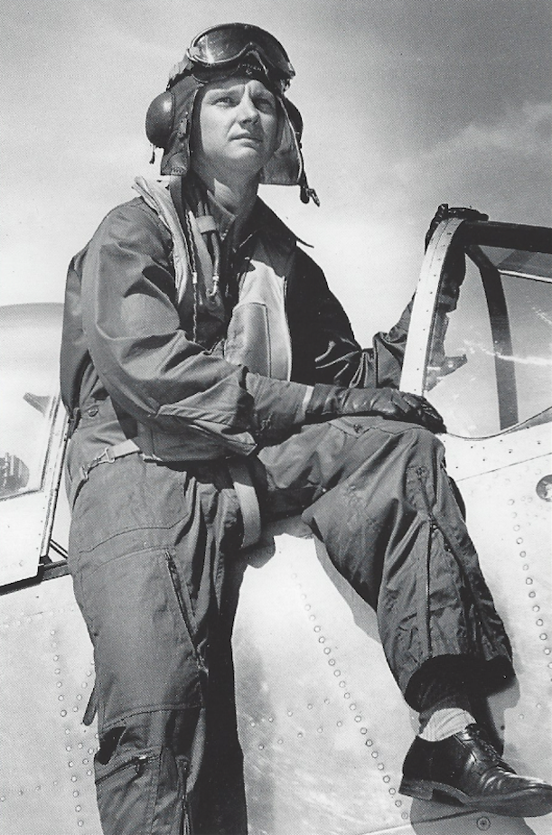 George S. Welch, now a civilian test pilot forNorth American Aviation, Inc., sits on the canopy rail of a P-51H Mustang, circa 1945. (North American Aviation Inc.)