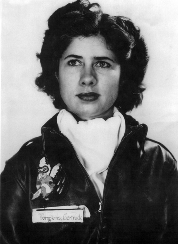 “Tommy” Tompkins, wearing her A-2 leather flight jacket and a pilot’s white silk scarf. The “Fifinella” gremlin insignia was designed by the Walt Disney Company. (U.S. Air Force)