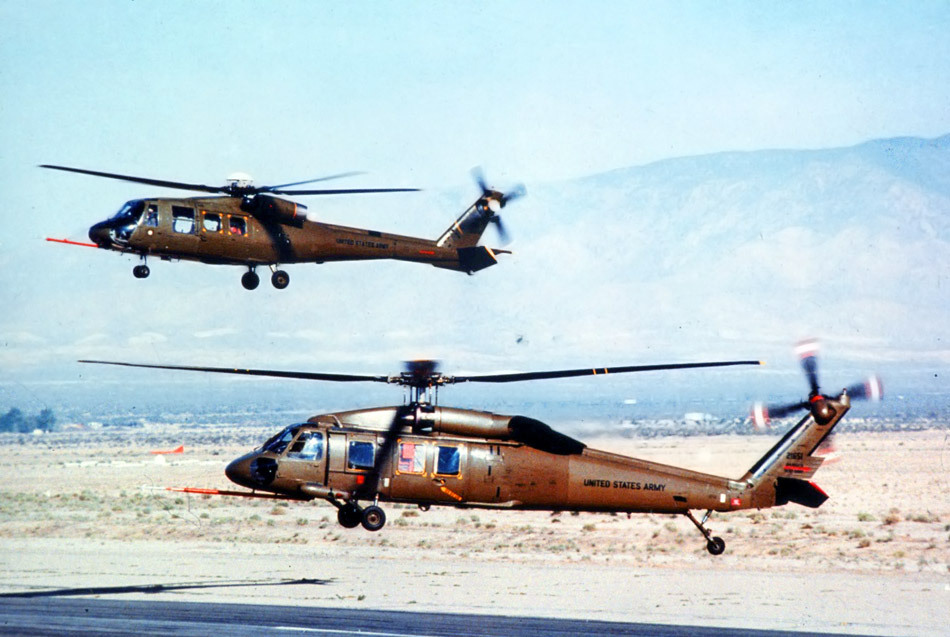 A Sikorsky YUH-60A and Boeing Vertol YUH-61A hover for the camera. (U.S. Army)