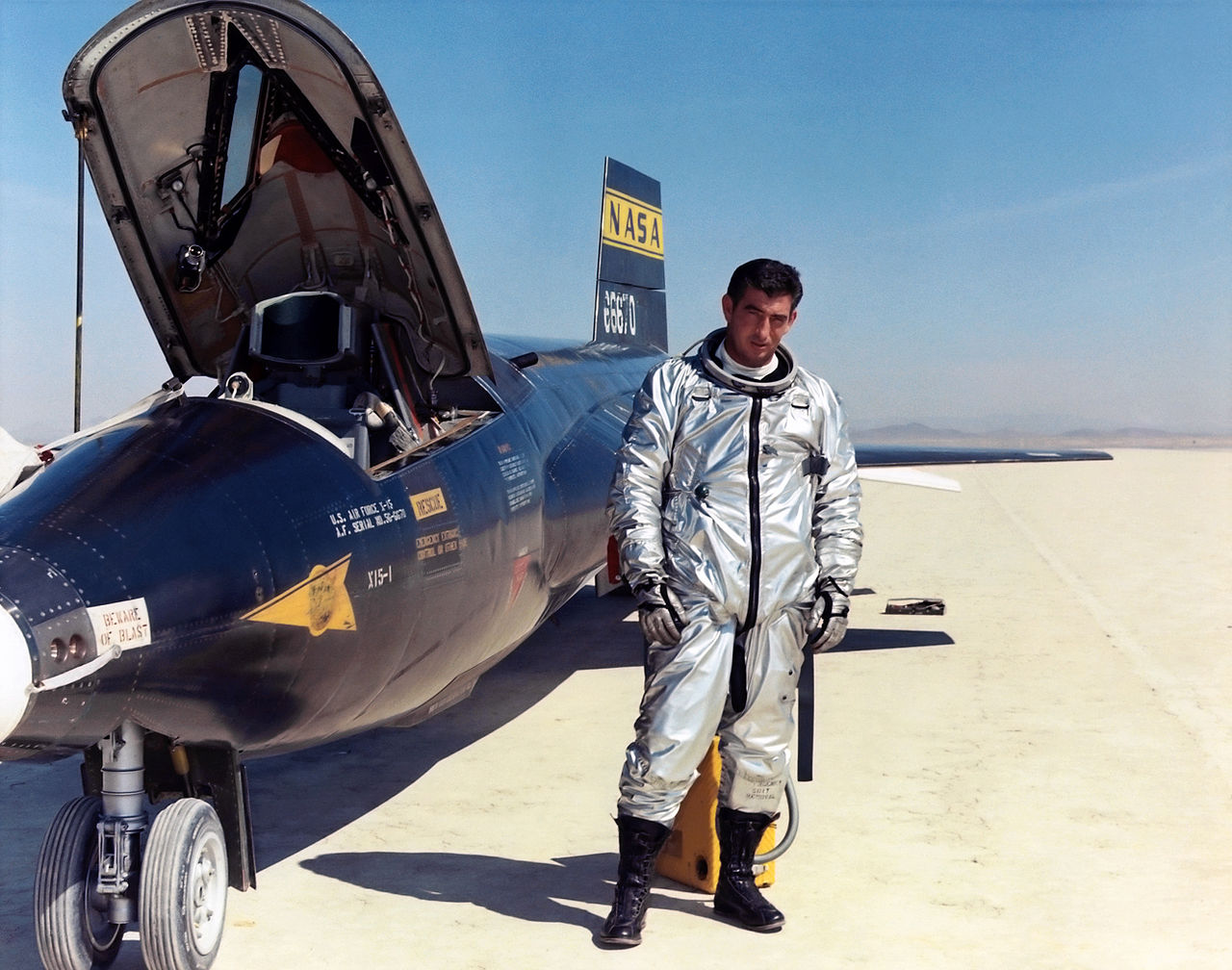 Major Michael J. Adams, United States Air Force, with an X-15 hypersonic research rocketplane on Rogers Dry Lake. (NASA)