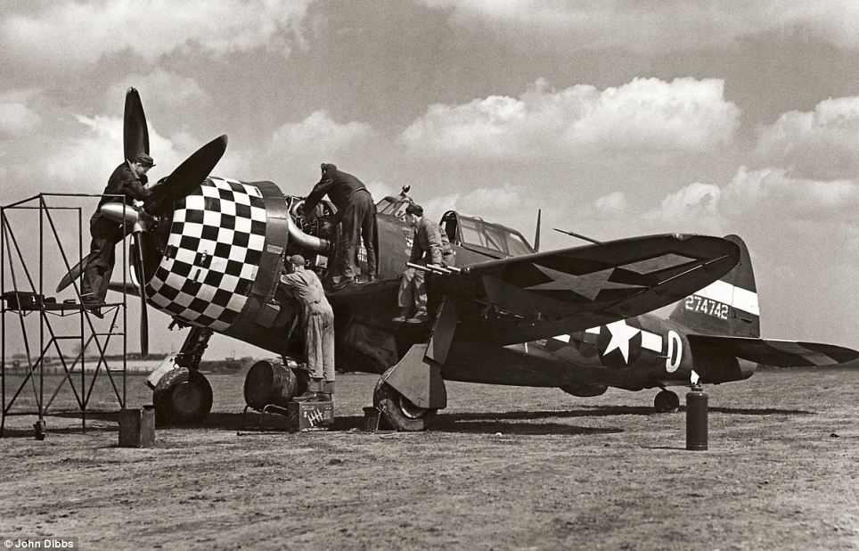 Republic P-47D-6-RE Thunderbolt 42-74742 at RAF Duxford during World War II. The maintenance technicians show the fighter's enormous size. (Daily Mail)