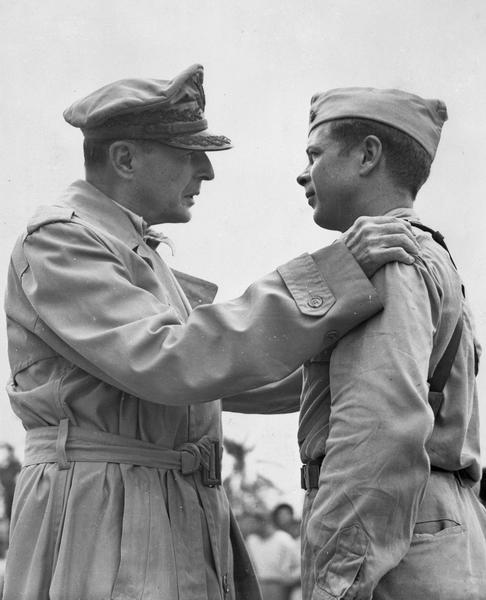 General Douglas MacArthur talks with Major Richard I. Bong, 12 December 1944. (U.S. Air Force)