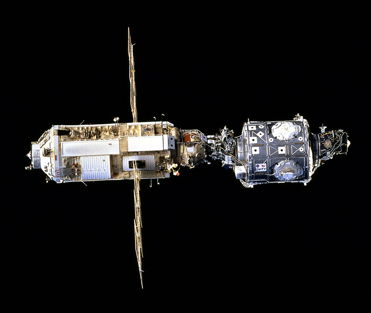 U.S.-built Unity module (right) attached to Russian-built Zarya module, forming the basic components of the International Space Station (ISS), photographed in Earth orbit, 15 December 1998. (National Aeronautics and Space Administration STS088-703-019)