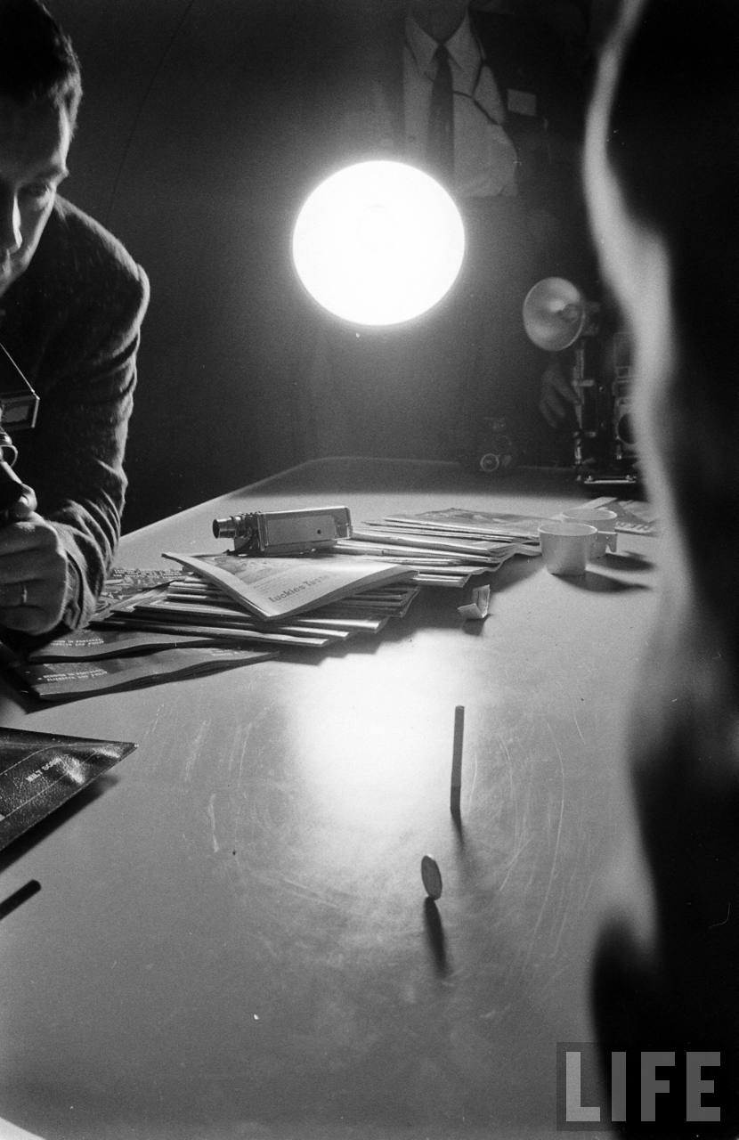 Reporters balance a pen and a coin in the Dash 80's vibration-free cabin. (Leonard Mccombe/LIFE Magazine)