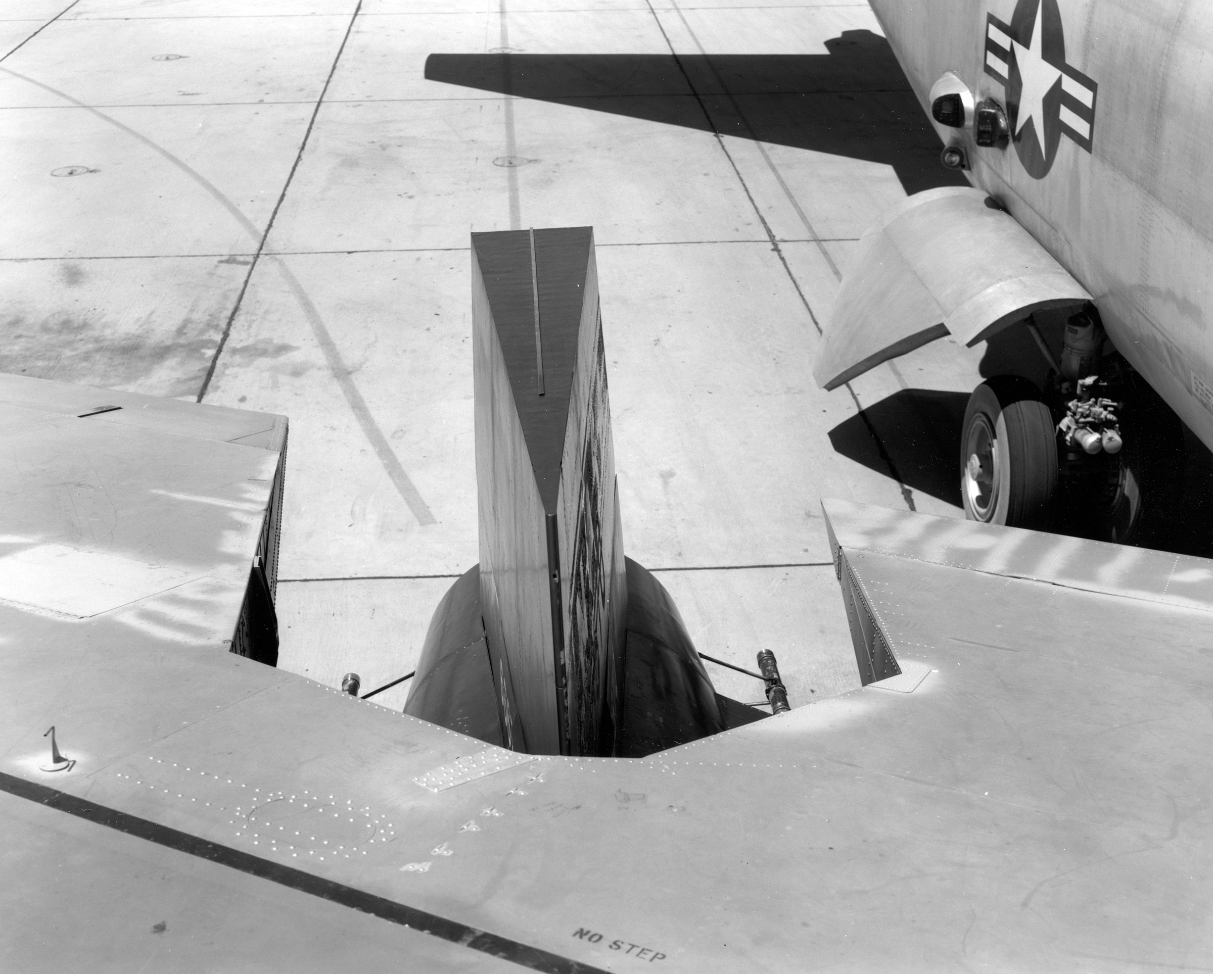 To allow clearance for teh X-15's vertical fin, a notch had to be cut in the trailing edge of the inboard right flap. (NASA)